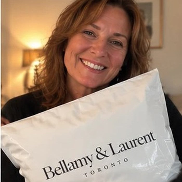 Customer hugging her Bellamy & Laurent package
