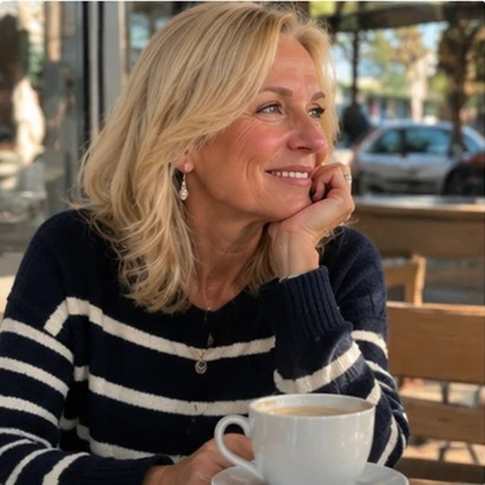 Customer in a striped sweater at a cafe